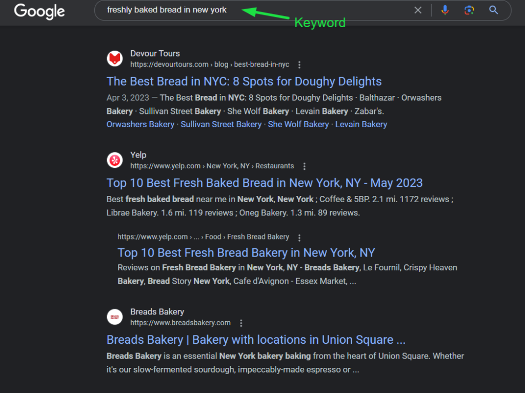 A screenshot of a Google search for "freshly baked bread in New York", highlighting the use of the keyword in the search results.
